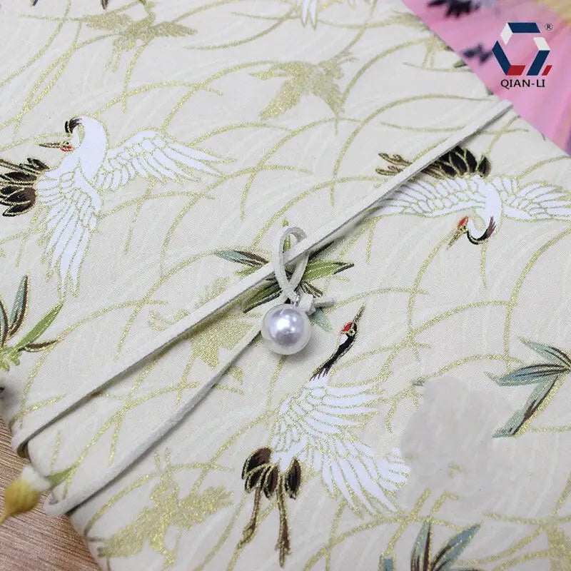 Notebook en Tissu Doré – Motif Grue